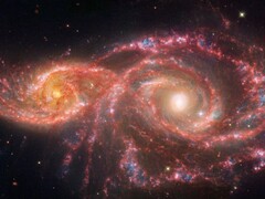 Zdjęcie wykonane przez Kosmiczny Teleskop Jamesa Webba, przedstawiające łączące się galaktyki IC 2163 i NGC 2207. (Źródło zdjęcia: © NASA, ESA, CSA, STScI)