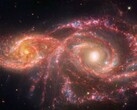 Zdjęcie wykonane przez Kosmiczny Teleskop Jamesa Webba, przedstawiające łączące się galaktyki IC 2163 i NGC 2207. (Źródło zdjęcia: © NASA, ESA, CSA, STScI)
