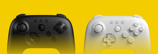 Kontroler 8BitDo 64 jest dostępny w czarnej i białej wersji kolorystycznej. (Źródło obrazu: 8BitDo)