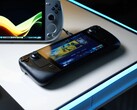 Steam Deck wyświetlający ekran główny SteamOS leży na świecącym białym biurku obok różnych przenośnych komputerów do gier z systemem Windows, w tym urządzeń ASUS ROG Ally i Ayaneo. (Źródło zdjęcia: Notebookcheck)