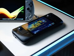 Steam Deck wyświetlający ekran główny SteamOS leży na świecącym białym biurku obok różnych przenośnych komputerów do gier z systemem Windows, w tym urządzeń ASUS ROG Ally i Ayaneo. (Źródło zdjęcia: Notebookcheck)