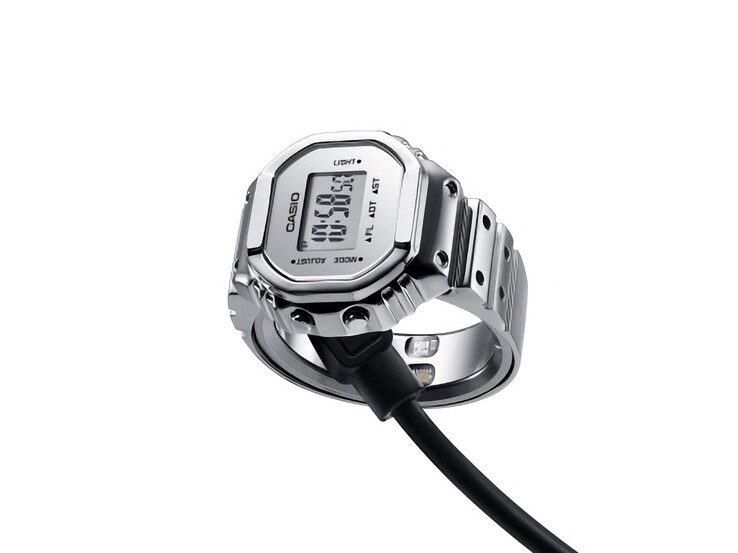 Inteligentny zegarek Casio CRW-H001M-8 podłączony do magnetycznego kabla USB służącego do ładowania.