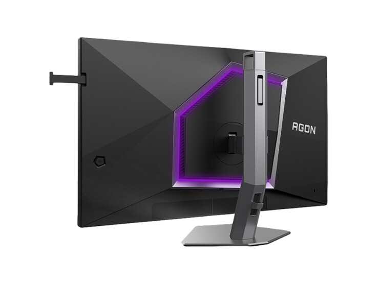 Zdjęcie przedstawia tył monitora gamingowego AOC Agon Pro AG276UZ o dość charakterystycznym dla gier wyglądzie z fioletowym podświetleniem RGB.