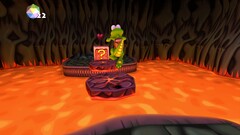 Croc Legend of the Gobbos - zrzut ekranu przedstawiający Croca przeskakującego nad lawą