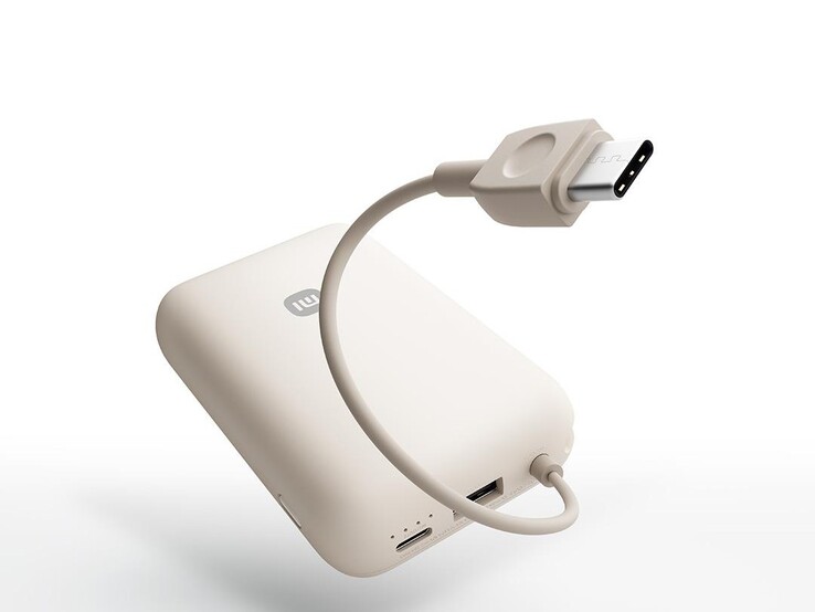 Power bank posiada wbudowany kabel USB-C oraz dodatkowe porty USB-C i USB-A