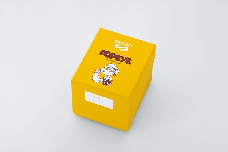 Żółte pudełko prezentacyjne z limitowanej edycji przeznaczone dla modelu Seiko 5 Sports x Popeye HDB013, z logo Popeye oraz grafiką rocznicową.
