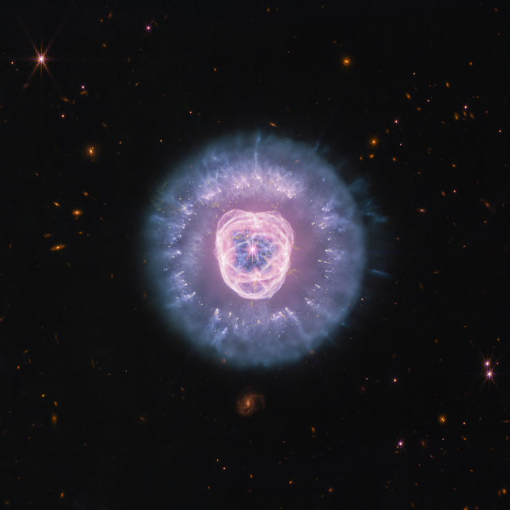 Zdjęcie galaktyki NGC 2392 wykonane przez Kosmiczny Teleskop im. Jamesa Webba przy użyciu instrumentów NIRCam i MIRI.