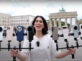 Vivo X200 Ultra koronowany na króla zoomu. Na zdjęciu osoba trzymająca telefony testowe. (Źródło zdjęcia: Versus; przycięte)