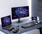 Monitor gamingowy Asus XG27UCMG wraz z różnymi urządzeniami elektronicznymi marki Asus