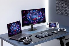 Monitor gamingowy Asus XG27UCMG wraz z różnymi urządzeniami elektronicznymi marki Asus