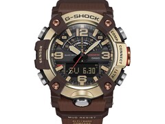 Zbliżenie na model G-Shock Mudmaster GG-B100XMH-5A, ukazujące jego jasnożółto-złotą i brązową kopertę oraz ramkę.