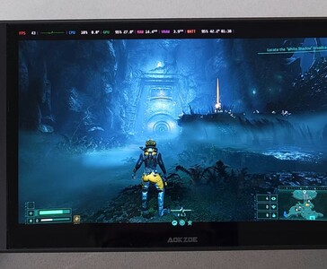 Returnal działający na komputerze przenośnym AMD Ryzen AI 9 HX 370, pokazujący na ekranie test wydajności w grze. (Źródło obrazu: The Phawx)