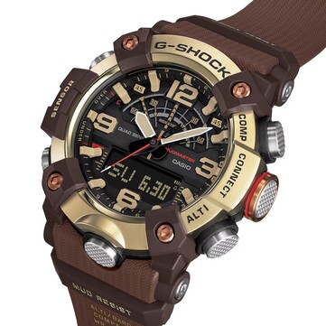 Widok pod kątem zegarka G-Shock Mudmaster GG-B100XMH-5A, prezentujący jego wyświetlacz cyfrowo-analogowy oraz jasnożółto-brązową kolorystykę.