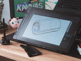 Huion Kamvas 16 Gen 3 na biurku z rysikiem, rękawicą do rysowania i klawiaturą