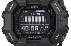 Zegarek Casio G-Shock Mudman GDG-B100 z czerwono-białym wyświetlaczem cyfrowym na tle surowego górskiego krajobrazu.